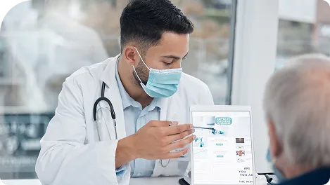 Clinician showing a patient information on a tablet
